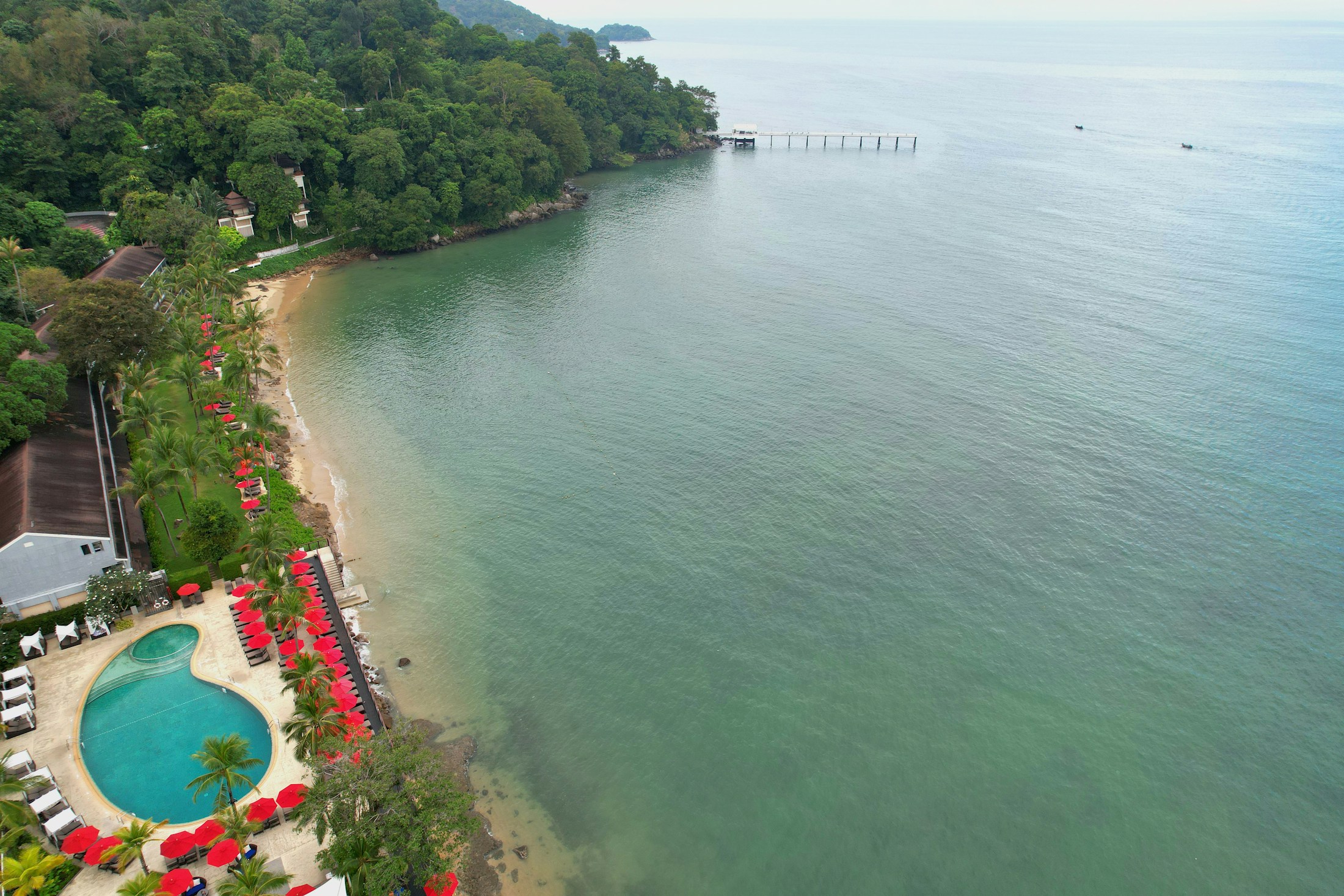 ZO Hotel Goa by the coast, with palms and calm water